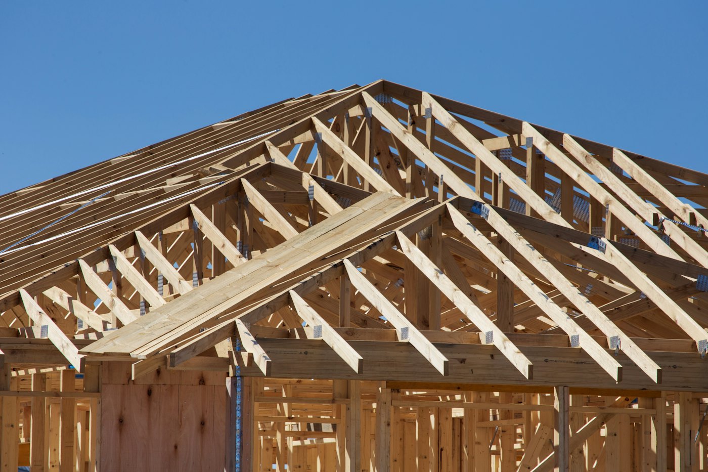 Timber roof trusses on a house frame